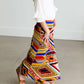 Girl wearing a modest maxi dress that is multi color and stretchy