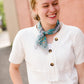 White modest v-neck button detail top