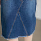 The Riley Frayed Hem Denim Midi Skirt is an Inherit Design that is full of lovely details! It is tailored in a slight a-line fit and super comfortable for anyone wanting that timeless look! This skirt is a darker wash with contrast stitching with a v-stitch in the front and back. You will love the raw bottom hem and the faux leather patch on the back!