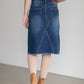 The Riley Frayed Hem Denim Midi Skirt is an Inherit Design that is full of lovely details! It is tailored in a slight a-line fit and super comfortable for anyone wanting that timeless look! This skirt is a darker wash with contrast stitching with a v-stitch in the front and back. You will love the raw bottom hem and the faux leather patch on the back!