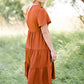 orange ruffle tiered midi dress
