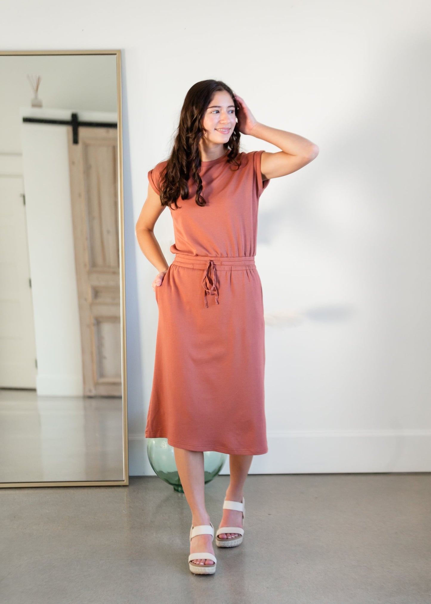 Your favorite dress is back in a brand new color! The Sami Terracotta Knit Midi Dress from our Inherit Name-sake label is the best dress for so many reasons. It drapes beautifully and feels casual, but looks so refined and feminine. The soft fabric has a bit of stretch and the sleeve length is very flattering. Tie waist for customizable fit and did we mention it has pockets?