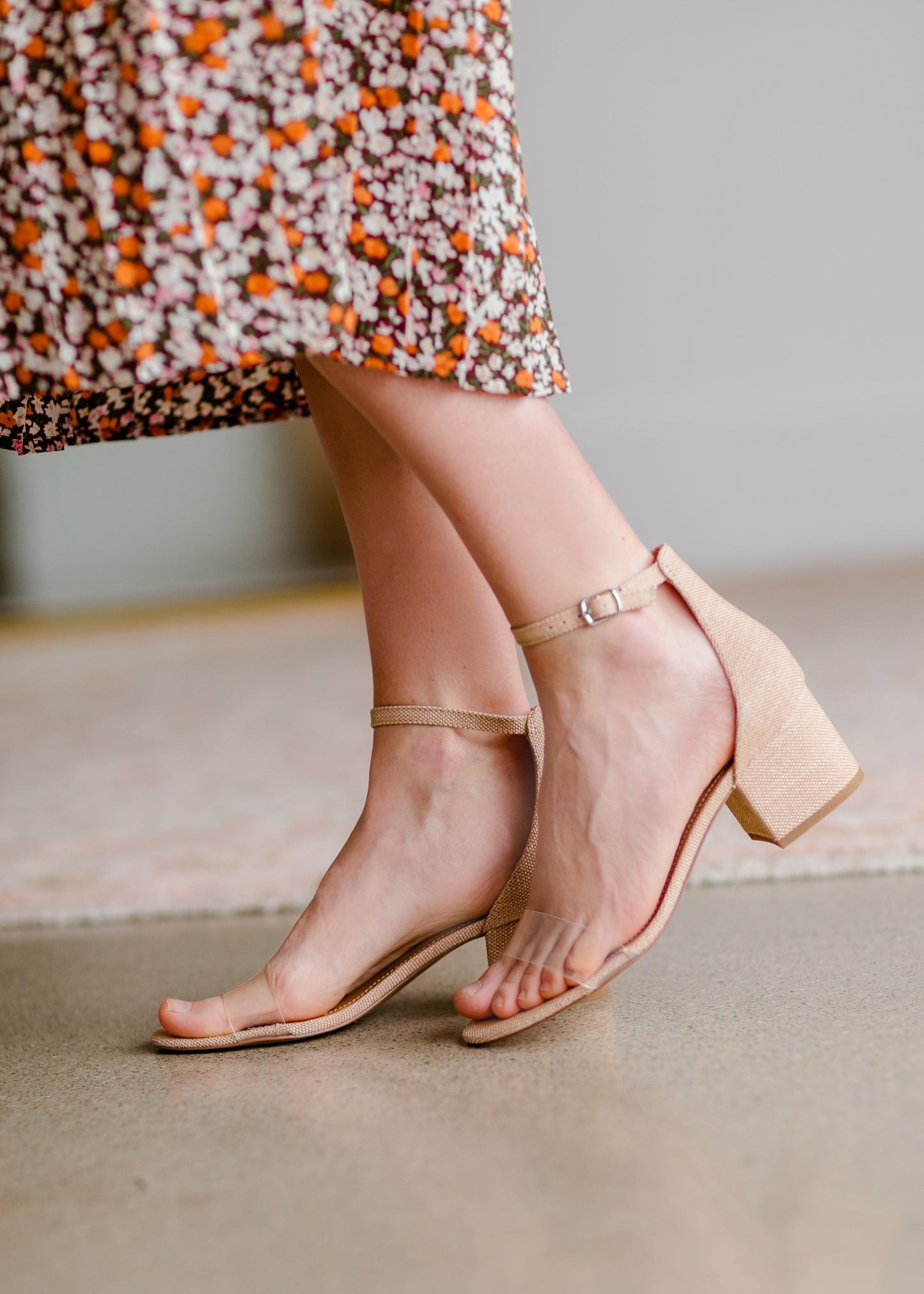 Embrace the warm weather with the Steve Madden Irenee Ankle Wrap Block Heel! It features a trendy, clear toe strap and block heel. This sandal will take any outfit to the next level with it's neutral tones and look!