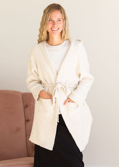 Ultra Soft Hooded Robe comes in ivory or pink, with a tie waist, large front pockets, and hood.