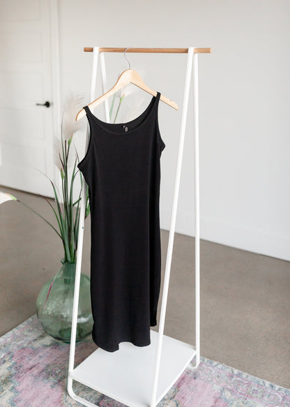 Women's Full Slip Dresses InheritPerfect for layering under dresses, this modest full slip will be a closet staple. It features a rounded bottom hem with a scalloped side edge, a modest neckline, and tank top style straps.