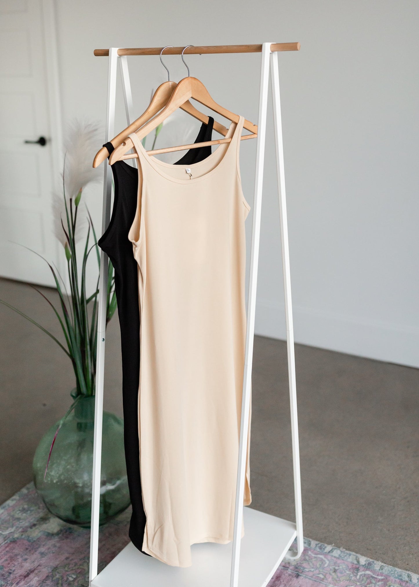 Women's Full Slip Dresses InheritPerfect for layering under dresses, this modest full slip will be a closet staple. It features a rounded bottom hem with a scalloped side edge, a modest neckline, and tank top style straps.