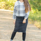 Crafted from a cotton blend, this Zoey Frayed Hem Black Denim Midi Skirt is an Inherit Design you'll be reaching for again and again! This skirt has an on-trend, yet classic style to it. There is slight distressing and the raw hem is the perfect finishing touch!