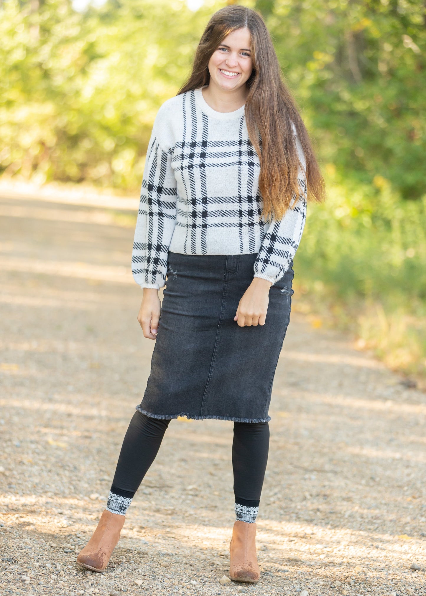 Crafted from a cotton blend, this Zoey Frayed Hem Black Denim Midi Skirt is an Inherit Design you'll be reaching for again and again! This skirt has an on-trend, yet classic style to it. There is slight distressing and the raw hem is the perfect finishing touch!