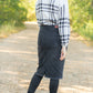 Crafted from a cotton blend, this Zoey Frayed Hem Black Denim Midi Skirt is an Inherit Design you'll be reaching for again and again! This skirt has an on-trend, yet classic style to it. There is slight distressing and the raw hem is the perfect finishing touch!